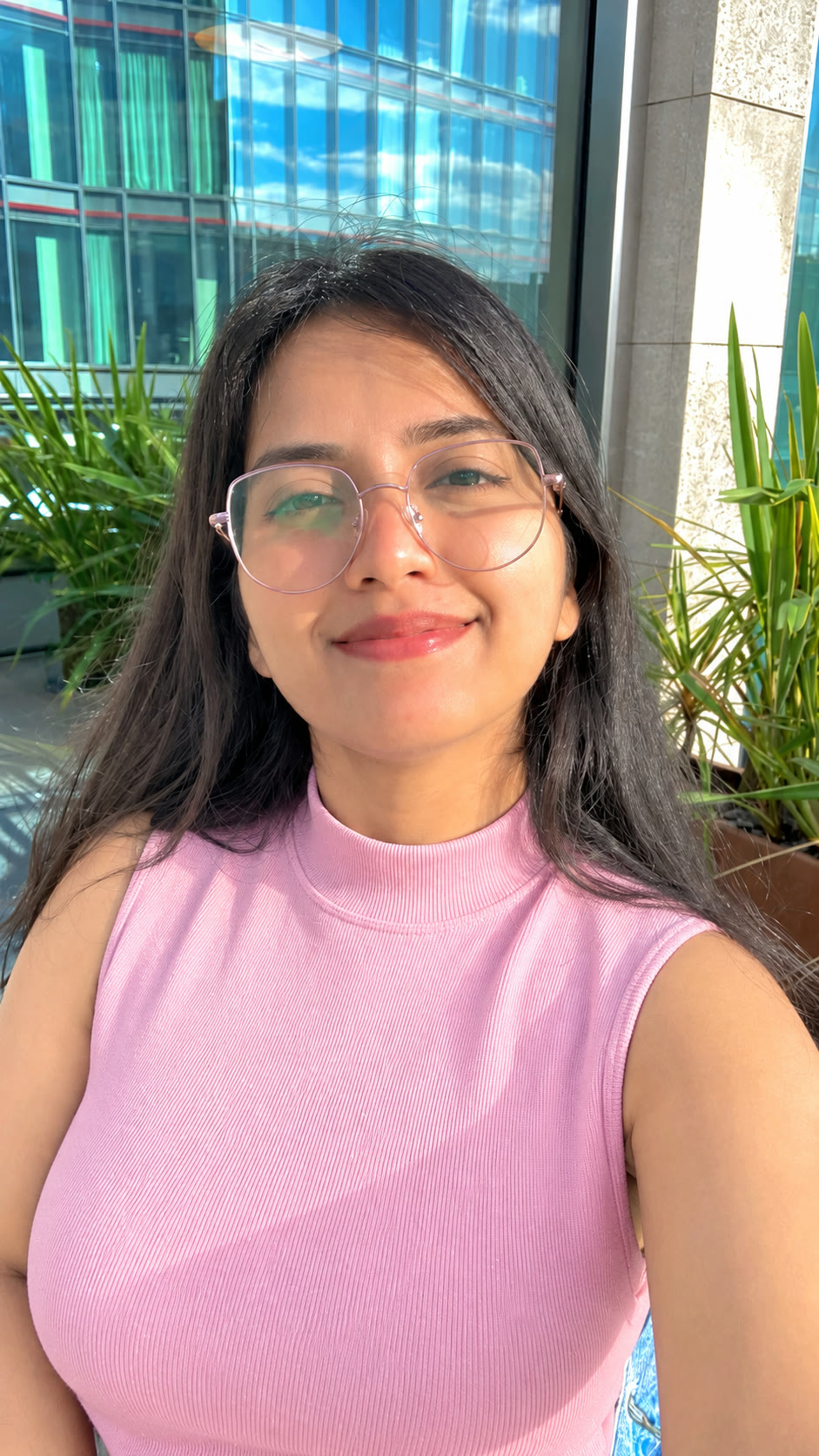 Aishwarya Sathe, smiling in the sunshine